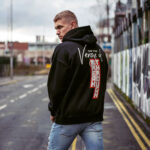 Model wearing Raverge men's black hoodie Verge of Breakthrough bold dynamic streetwear graphic backside view