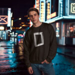 Model wearing men's Nexus black sweatshirt with sci-fi graphic design