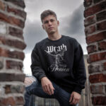 Model wearing men's Wrath of the Heaven black sweatshirt with dramatic graphic