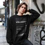 Man wearing Raverge men's Escape Velocity black sweatshirt featuring sci-fi graphics.