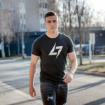 Black Raverge men's t-shirt with logo on the chest worn by a model