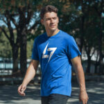 Blue Raverge men's t-shirt with logo on the chest worn by a model