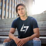 Navy Raverge men's t-shirt with logo on the chest worn by a model