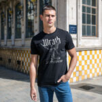 Model wearing the Wrath of the Heaven men’s t-shirt featuring an angel statue holding a sword. A striking t-shirt design symbolizing divine strength and heavenly wrath.