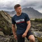 Male model showcasing Raverge's 'Shatter The Limits' navy t-shirt