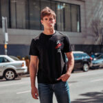 Model wearing black Raverge Bushido T-Shirt front with Japanese Bushido script and red slash graphic