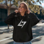 Model wearing Raverge women's black hoodie with the Raverge logo on the chest.