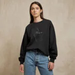 Model wearing Raverge New Dimension black sweatshirt - Minimalist geometric design