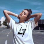 White Raverge women's t-shirt with logo on the chest worn by a model
