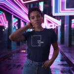 Model wearing navy Raverge women's Think Without the Box t-Shirt with bold typography design