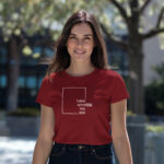 Model wearing red Raverge women's Think Without the Box t-Shirt with bold typography design