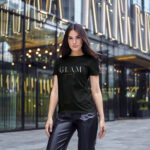 Woman wearing black Glam Girl t-shirt with stylish bold typography