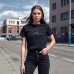 Model wearing Women’s New Dimension t-shirt with abstract rectangular shapes and futuristic design