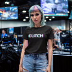 Model wearing Women’s Glitch black t-shirt with glitch-effect text design