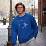 Model wearing the Raverge blue Think Without the Box sweatshirt with unique typography design