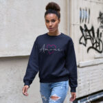 Model wearing Raverge Amour navy sweatshirt - Pink heart and script text design